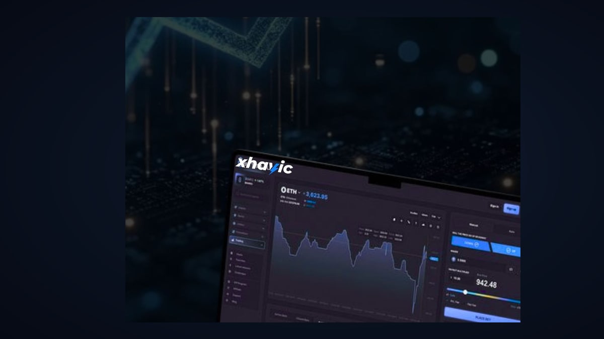 Xhavic Enterprise module — laptop displaying business dashboard with blockchain-powered treasury and operations